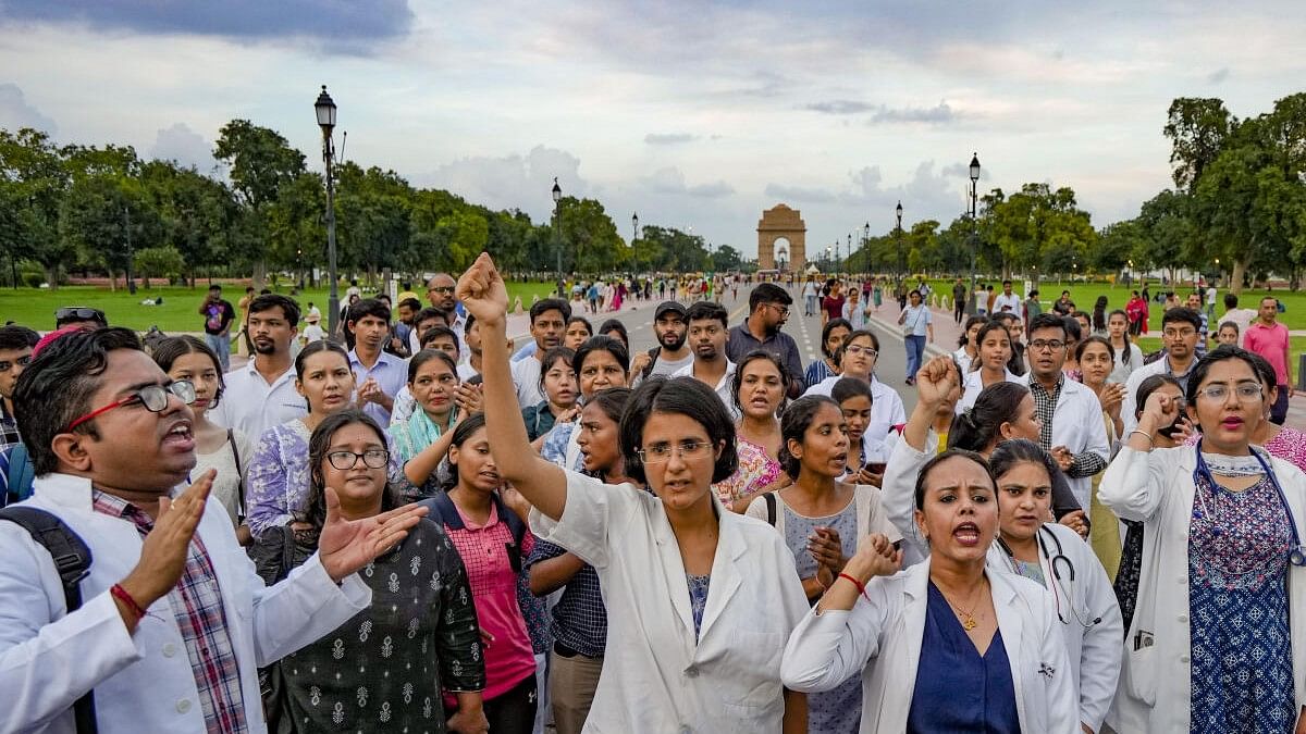 <div class="paragraphs"><p>Doctors, medical professionals and students stage a protest march demanding justice for a woman doctor who was allegedly raped and murdered at Kolkata's R G Kar Medical College and Hospital, at Kartavya Path i</p></div>